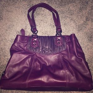 Purple leather Coach handbag.
